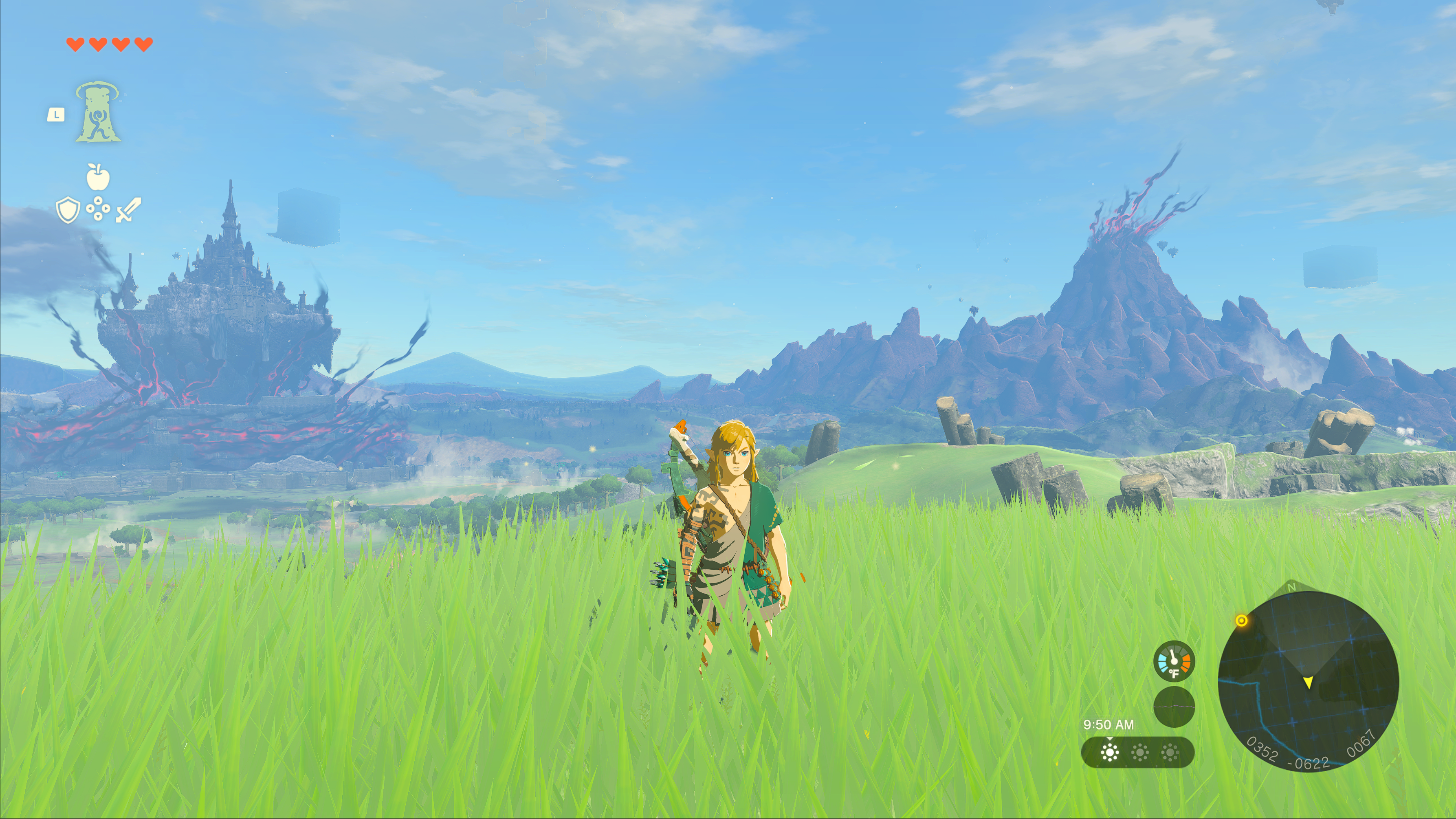 A screenshot from the Nintendo game Legend of Zelda Tears of the Kingdom. Link is standing in a grassy area. Behind him in the distance Hyrule castle and Death Mountain are visible.